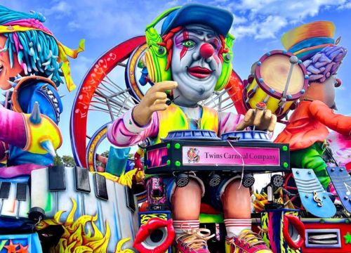 Malta Carnival float with vibrant artistic design and performers, highlighting traditional festival celebrations and spring events